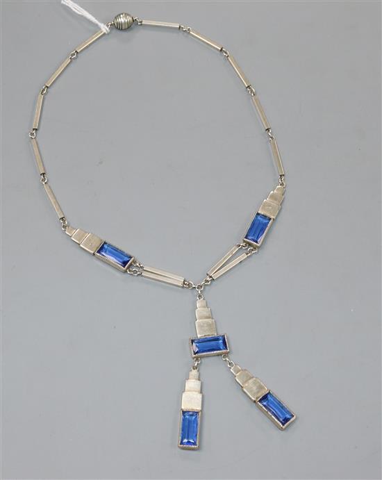 An Art Deco white metal and blue paste set drop tassle necklace, 56cm.